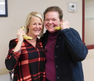 women holding bananas