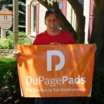 man holding dupagepads banner