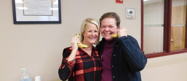 carol simpler and another woman holding a banana