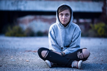 woman sitting wearing a hoodie